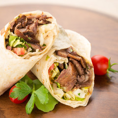Doner kebab on wooden background