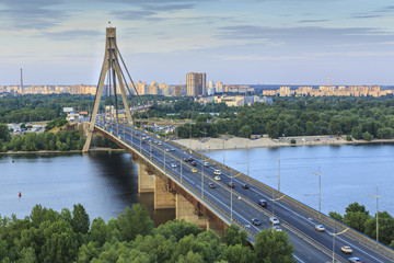 Bridge over Dnipro River in Kyiv city at sunset