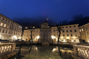 Fototapeta na wymiar Kapitelplatz and Hohensalzburg Castle at sunrise