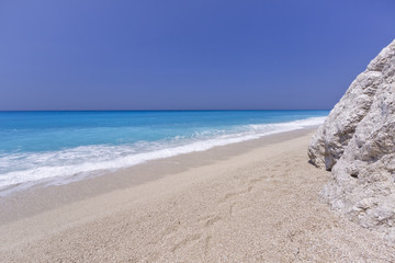Fototapeta na wymiar Greek beach. Summer background. Ionian sea.