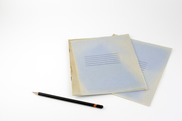 Old notebooks and black pencil - Free place for text