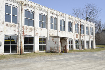 old white brick factory building © cfarmer