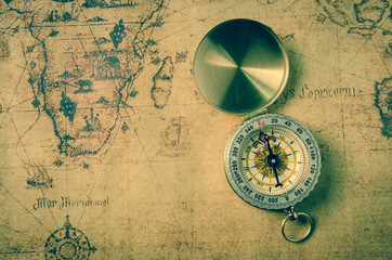 vintage compass on old map