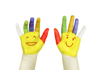 Smiley on colorful hands isolated on white.