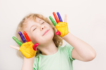 Little girl  hands painted in colorful paints