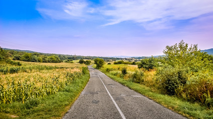 Naklejka premium Old country road with blue sky