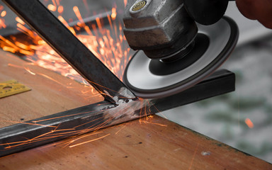 Grinder cutting metal