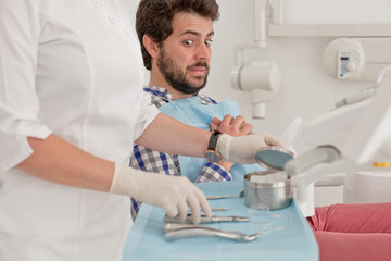 young man and woman in a dental examination at dentist