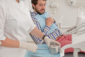 young man and woman in a dental examination at dentist