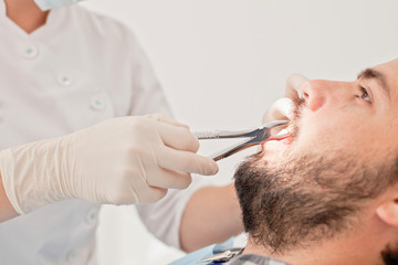 young happy man and woman in a dental examination at dentist