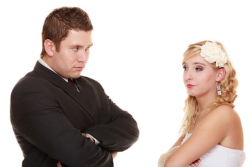 bride and groom looking at each other offended