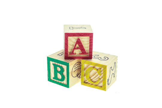 Close up ABC colorful alphabet blocks isolated on white