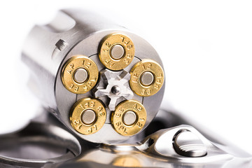 Macro shot of an open revolver loaded with bullets