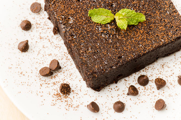Homemade Fudge Brownie with chocolate chip on white plate