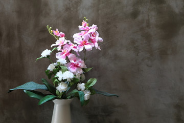 Fototapeta na wymiar Bouquet of peonies in a vase against wall. Interior