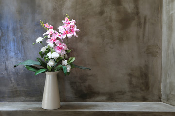 Fototapeta na wymiar Bouquet of peonies in a vase against wall. Interior