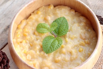 Corn soup of condensed in a wooden bowl