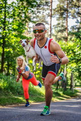 Fototapeta premium Smiling sportsman in sunglasses on the run
