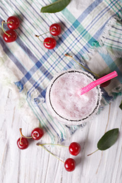 milkshake cherry in a glass. vertical top view