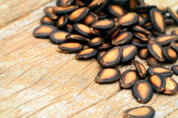 Watermelon seed on wood background
