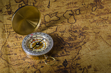 Fototapeta na wymiar Compass on old map