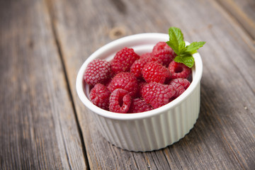 Fresh summer raspberries with mint leaf