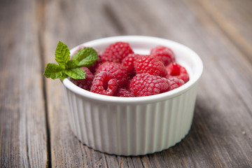 Fresh summer raspberries with mint leaf