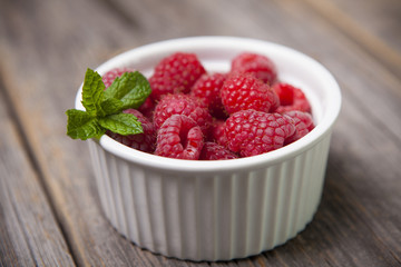 Fresh summer raspberries with mint leaf