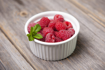 Fresh summer raspberries with mint leaf
