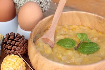 Corn soup of condensed in a wooden bowl