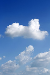 White fluffy clouds in blue sky