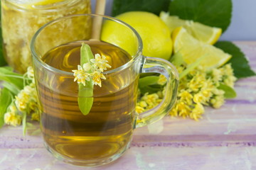 Linden tea with lemon decorated with lime flower