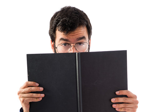 Vintage Young Man Hiding Behind A Book