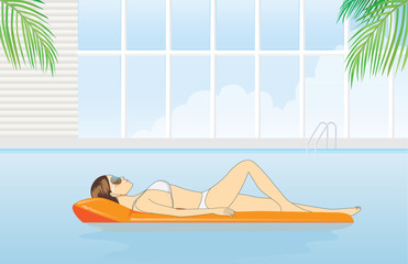 Women relaxing in a pool with resting on inflatable mattress