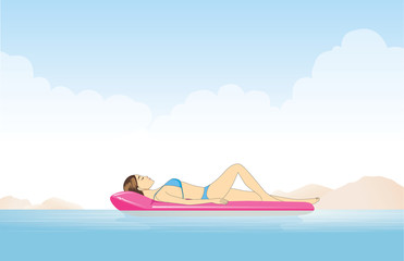 Women relaxing in the sea with resting on inflatable mattress