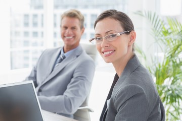 Fototapeta premium Smiling business partners working together