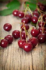 Fototapeta na wymiar Sweet cherries on wooden board