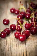 Sweet cherries on wooden board