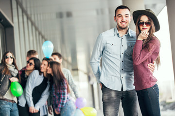 Happy teen girls and boys having good fun time outdoors. Selective focus