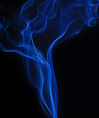 Fototapeta premium Blue smoke on black background