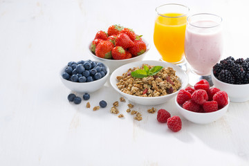 delicious and healthy breakfast on white wooden background