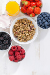 fresh berries, granola, juice and yogurt 