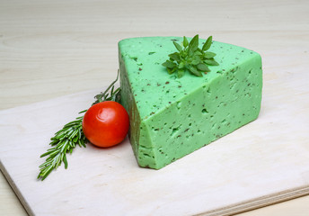 Green pesto cheese and basil leaves