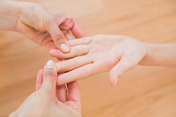  Physiotherapist doing hand massage