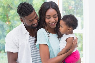 Happy parents with baby girl