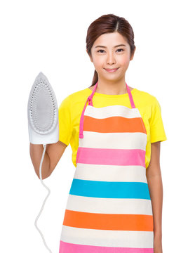Housewife using the steam iron