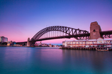 Fototapeta premium Beautiful sunset cityscape and harbour bridge.