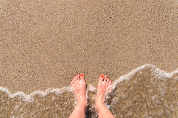 Ocean Sea Waves And Girl Feet On Summer Sand Beach