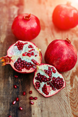 pomegranates on a dark wooden background