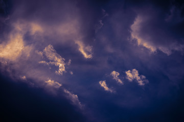 Dramatic sky with heavy clouds. Color toned image.